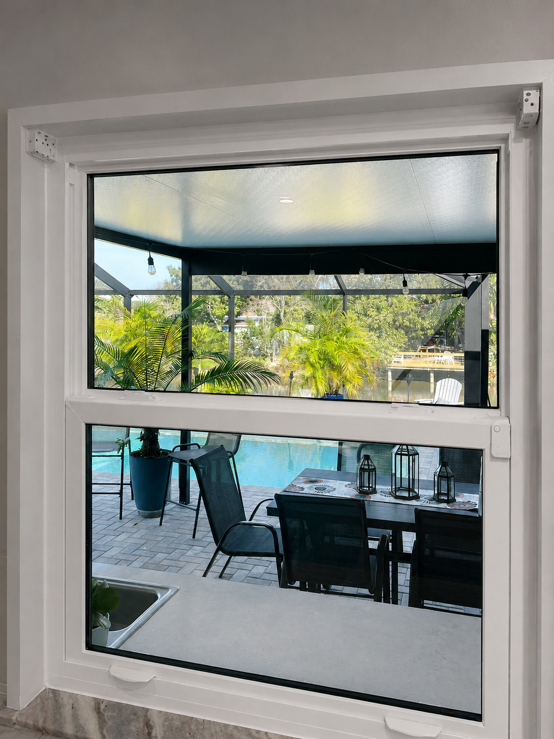 Impact window overlooking a pool