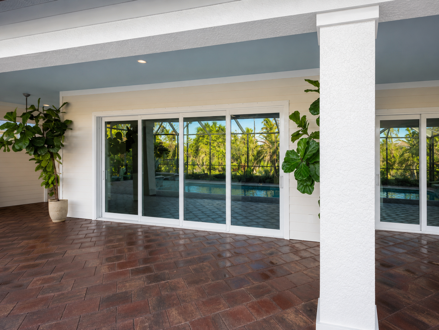 Sliding glass doors opening to a pool patio